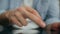 Man fingers typing tablet screen indoors close up. Unknown guy texting new tab