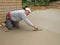 Man finishing concrete slab