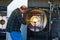 Man Firing Molten Glass