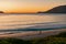 Man fishing on the beach, early morning at Jimmy\\\'s Beach at Hawk\\\'s Nest, NSW Australia