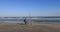 Man fishing beach ocean on chair Gulf of Mexico Texas 4K