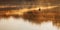 Man fishing on a boat in a mystic foggy lake