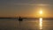 Man fishing in a boat at sunset in Albufera of Valencia