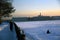 A man fishing on a frozen Neva river in historical city center of Saint-Petersburg