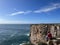 Man fishing from a high cliff at the Fortaleza de Sagres