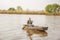 Man fishing on a lake- Fisherman in fishing boat