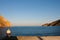 Man fishing at the port of Kamares, Sifnos island, Cyclades, Greece