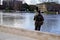 Man is fishing on the river charente in cognac city france