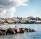 Man with fishing rod against Ibiza townscape