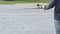 Man is fishing with a rod on background of river