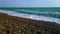 Man Fishing With Spinning From The Beach - Seaford, Sussex England, Uk. 4K Video