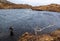 Man fishing for trout and salmon in a Scottish loch