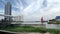 Man Fishing under white clouds at the mouth of Chaopraya river