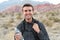 Man With Fit Body Drinking Water, Resting After Running Workout. Thirsty Male Drinking Refreshing Drink After Outdoor Training