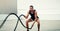 Man, fitness and battle rope exercise for physical training, workout or wellness in the outdoors. Fit, active and