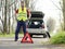 Man fixing a car problem after vehicle breakdown on the road