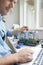 Man Fixing Electric Toaster Using Online Instructions Rather Than Buying New Product Sustainable Lifestyle