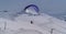 A man flies a hang glider in the Krasnaya Polyana ski resort, Sochi, Russia