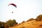 A man flies in his paraglider near Siria Medieval Fortress in Arad County, Romania.