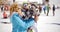 Man flirting with woman holding snowboard