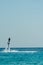 Man on flyboard above the azure sea. Water sport adventure