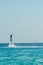 Man on flyboard above the clear sea. Water extreme sports