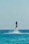 Man on flyboard above the clear sea. Water extreme sports