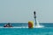 Man on flyboard above the clear sea. Water extreme sports