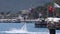 A man on a flyboard entertains vacationing tourists on the Turkish coast in Kemer