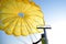 A man folds a parachute for paragliding on a boat