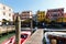 A man follow past empty openair seafood market rows in Venice. Mercato di Rialto