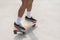 Man foot playing skateboard sweeping turns on surf skate on street road, control motion balancing movement extreme outdoor