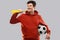 Man or football fan with soccer ball and vuvuzela