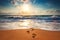 Man footsteps on the beach going toward the sea, orange sunrise shot