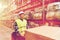 Man on forklift loading cargo at warehouse