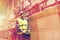 Man on forklift loading cargo at warehouse