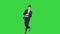Man in formal business suit walks in and dances several hip hop moves to camera on a Green Screen, Chroma Key.