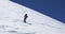 Man freeride skiing down snowy mount ridge in sunny day.Mountaineering ski activity. Skier people winter snow sport in