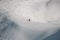 Man freerider gliding down the snowy mountain slope