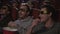 Man friends eating popcorn at 3d cinema movie. Men have fun at cinema