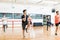 Man With Friends Performing High Knee Running In Aerobics Class