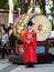 A man in front of a large drum at the Changing of the Royal Guard ceremony at the main entrance to Deoksugung Palace in Seoul