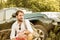 Man in front of SUV car during safari adventure trip