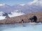 Man by the frozen lake in Aconcagua mountain in Argentina