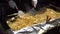 Man frying Japanese style noodle in a vendor