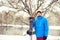 Man in a funny hat with snowboard