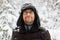 Man in fur winter hat with ear flaps smiling portrait