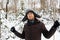 Man in fur winter hat with ear flaps smiling portrait