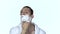 Man gets shaving aid on face. White background. Slow motion