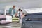 Man getting his suitcase on baggage claiming area in airport